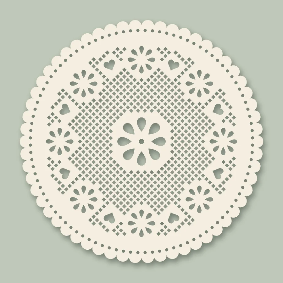 An ivory round paper doily with flowers around a large center flower