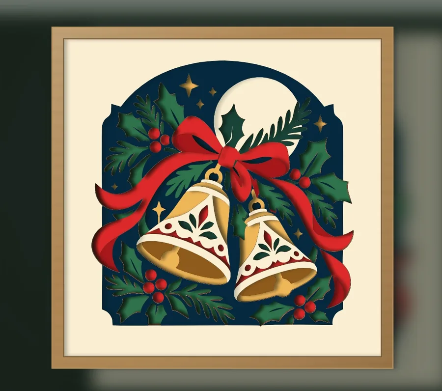 Finished Christmas bells with holly layered papercut in a frame