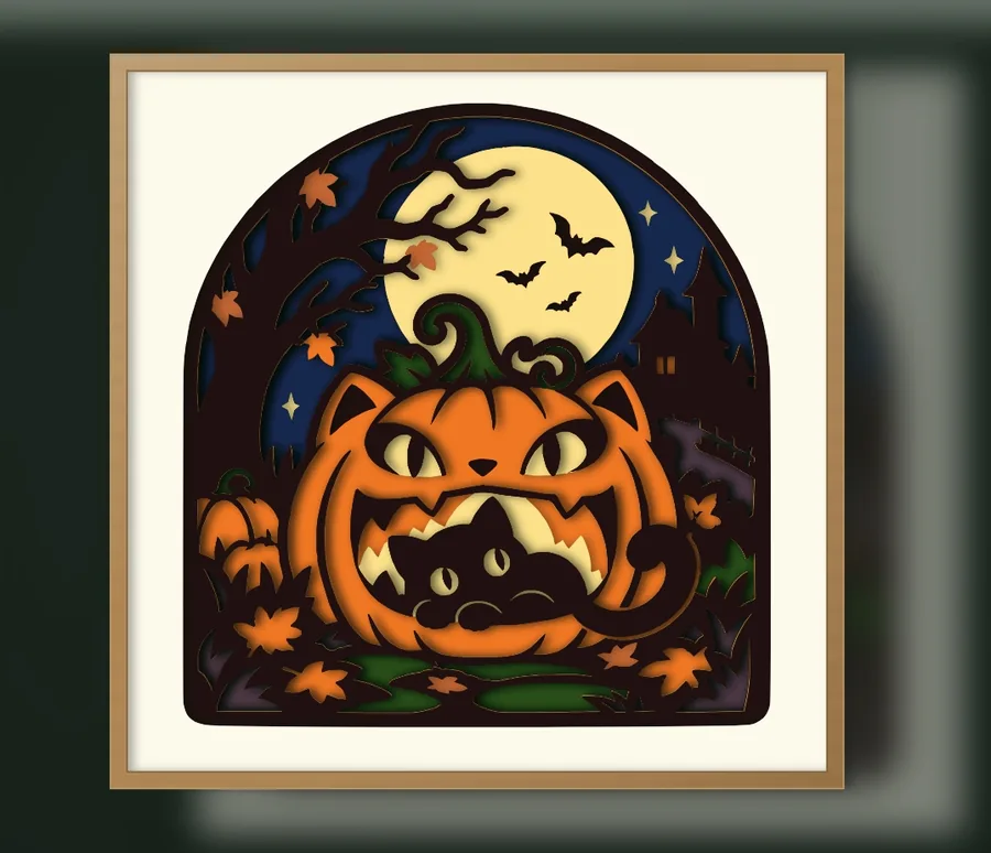Finished black cat in a jack-o'-lantern layered papercut in a frame